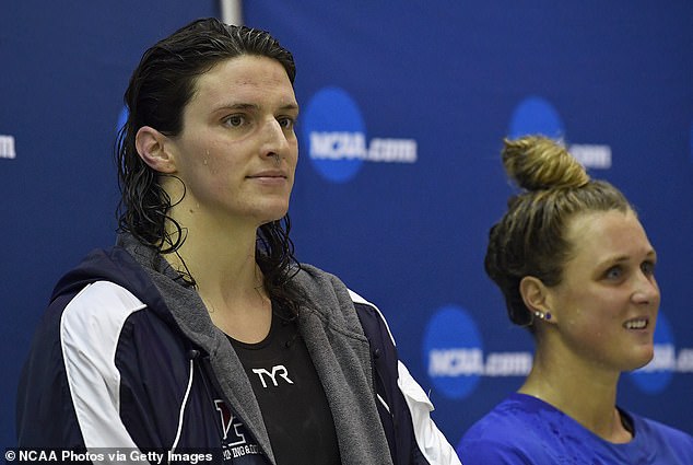 Russell talked about transgender swimmer Lia Thomas winning an NCAA championship, beating her biologically female competitors in a situation the lacrosse coach believes is wrong.  Thomas (left) is pictured during a competition in which she received the winning trophy despite tying with her biologically female competitor, Riley Gaines (right).