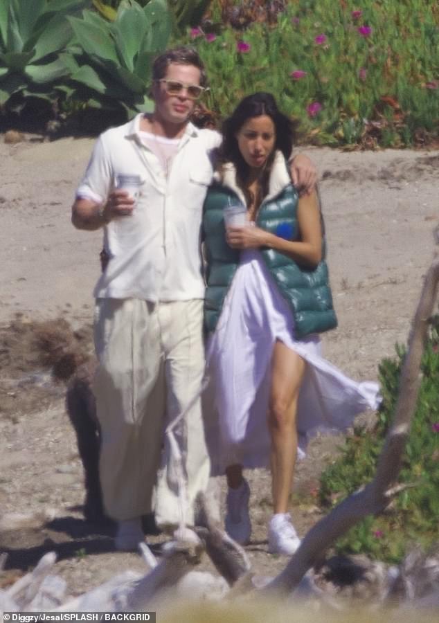 The couple seemed to be in good spirits as their relationship progresses and becomes serious.  Her walk on the beach is the first time the couple has been seen since she moved into her house.