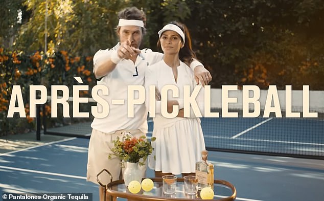In the promotional video, Matthew, 54, rolls a bar table onto a pickleball court and asks Camila: 