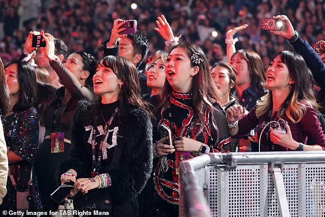 The multi-award-winning singer will take to the stage at Murrayfield Stadium to perform in front of around 215,000 fans between June 7 and 9.  In the photo: Fans go crazy in Tokyo.
