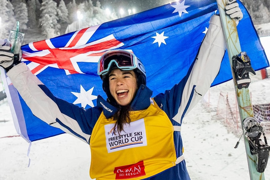 Jakara Anthony holds an Australian flag