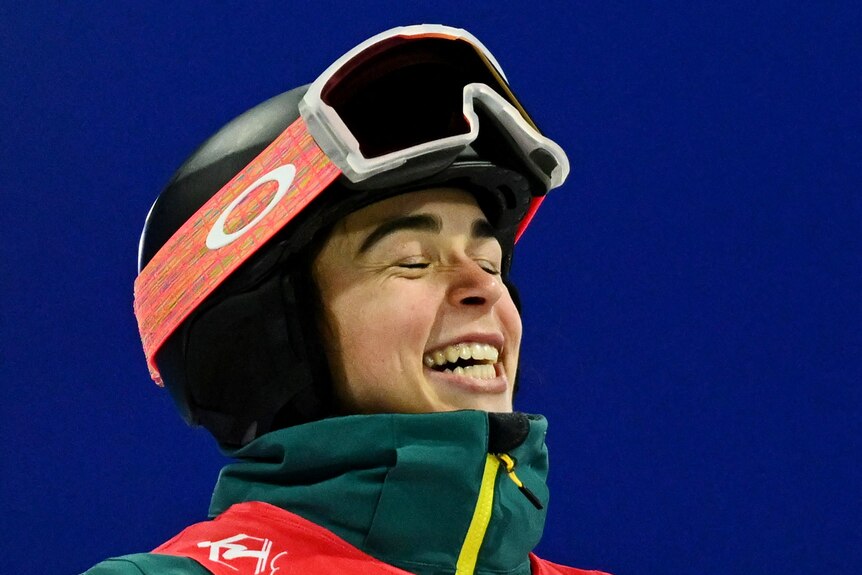 An Australian ski mogul celebrates winning gold.