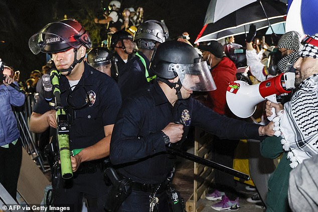 At least 132 protesters were arrested and one officer was injured during the tense confrontation between protesters and police dressed in riot gear.