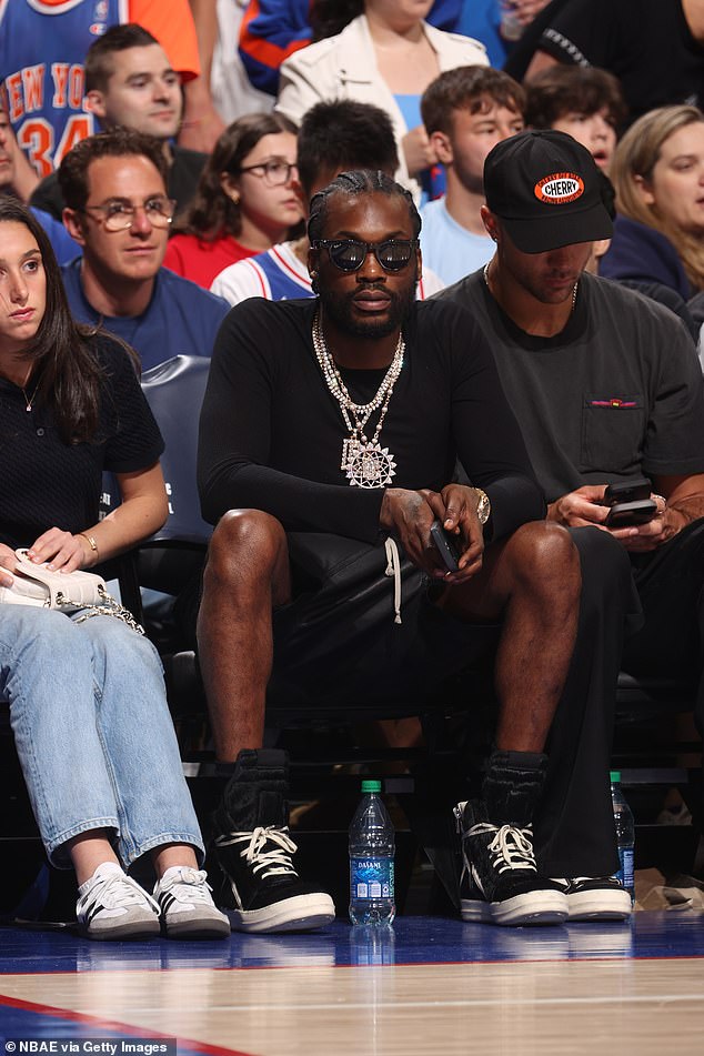 Meek Mill wore all black to the Knicks-76ers game Thursday night at the Wells Fargo Center.