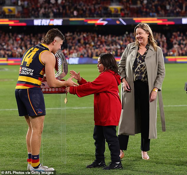 Crows gun Matt Crouch said Soligo (pictured receiving his medal on Thursday night) has all the skills to be one of the AFL's best midfielders.