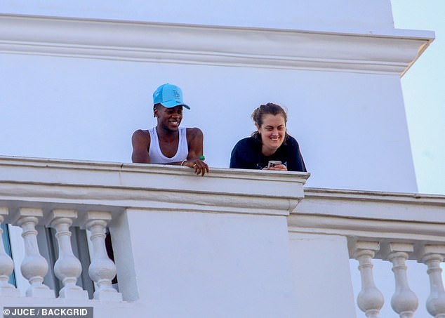 His son David Banda, 18, smiled while wearing a light blue hat during his stay at the Copacabana Palace in Rio de Janeiro.
