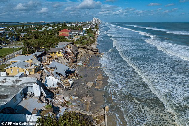 An aerial view of destroyed beachfront homes following Hurricane Nicole in Daytona Beach, Florida