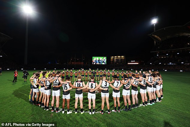 The timing of the Hall of Fame honor was horrifying for the AFL, which is having players in every Round 8 game make public gestures as the league takes a stance on violence against women (pictured, players from Crows and Power during a minute's silence on Thursday).  evening)