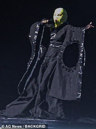 The singer also made a splash in a floor-length cape dress with huge sleeves.