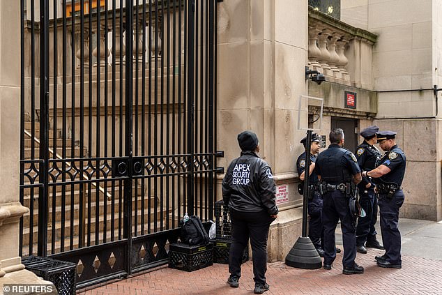 Private security agents and New York police stand guard at the gates of Columbia University after clearing its camp in Gaza.