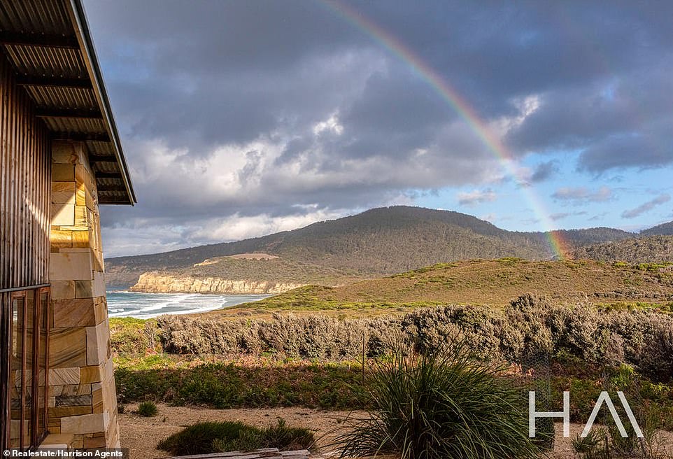 Spread across 10 acres and overlooking Tasmania's iconic coastline, the home is the perfect combination of cozy and stylish outdoor cabin living.