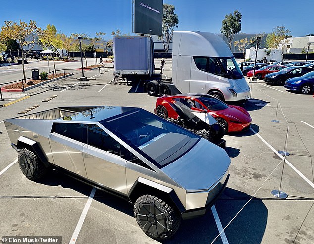 A Tesla Cybertruck parked next to several other vehicles