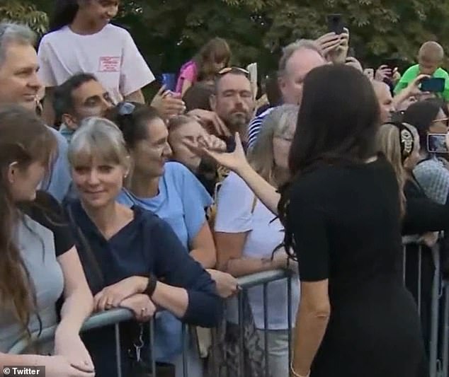 Meghan was ignored by a supporter, who was paying her respects to the late Queen, after attempting to shake her hand.