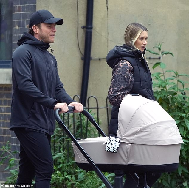 As the couple finished the rainy day, the hitmaker pushed the stroller as he spent some quality time with his family after his recent string of shows.