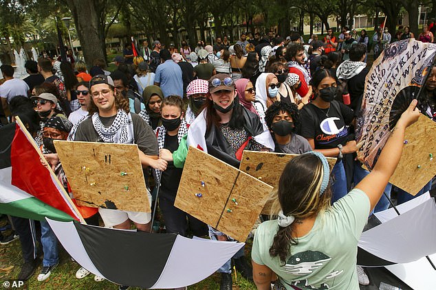 Some of the protesters raised wooden shields and umbrellas when police arrived with tear gas to break up the demonstration.
