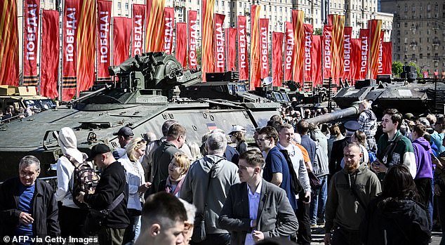 People visit an exhibition showing Western military equipment captured by Russian forces in Ukraine, displayed at the World War II memorial complex on western Poklonnya Hill in Moscow, May 1.