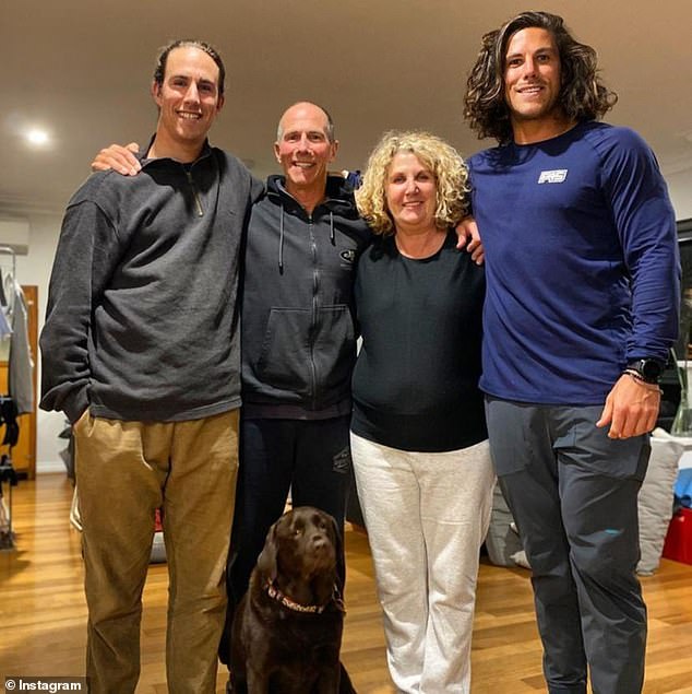 Jake (left) and Callum Robinson (right) have not been heard from for days after they went missing on a surfing trip to Mexico (pictured with their parents).