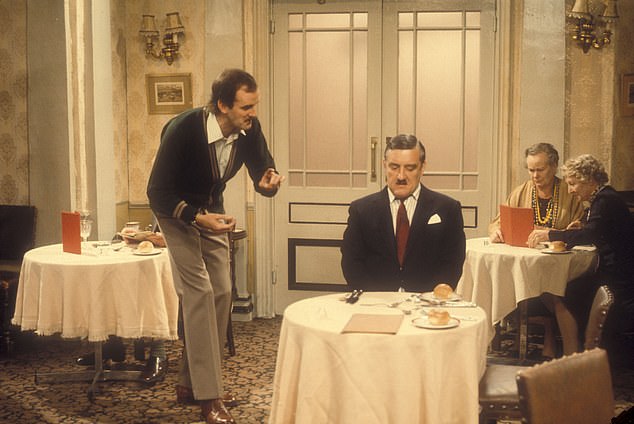 Basil Fawlty talks to guest Hutchinson, played by Bernard Cribbens