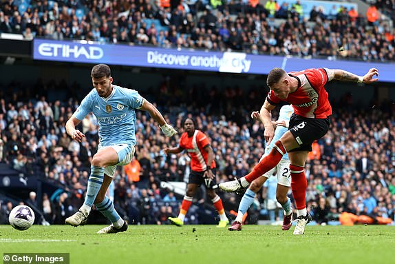 MANCHESTER, ENGLAND - APRIL 13: Ross Barkley of Luton Town scores his team's first goal during the Premier League match between Manchester City and Luton Town at the Etihad Stadium on April 13, 2024 in Manchester, England.  (Photo by Matt McNulty/Getty Images) (Photo by Matt McNulty/Getty Images)