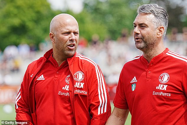 The Feyenoord manager (left) is believed to be close to confirming his move to Anfield.