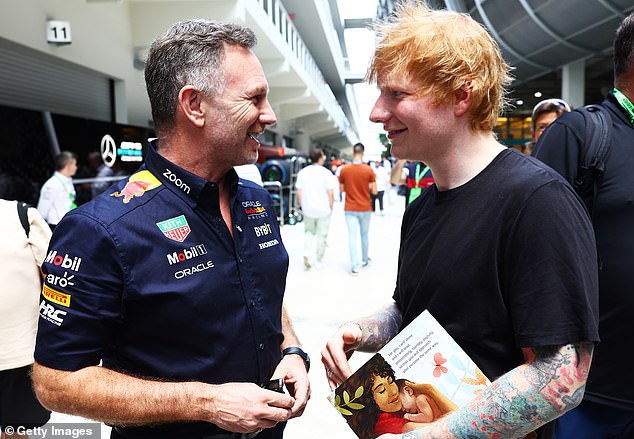 The hitmaker, who was recently spotted during a rare date night with his wife, was also pictured as he spoke to motorsports executive Christian Horner during his tour of the facility.