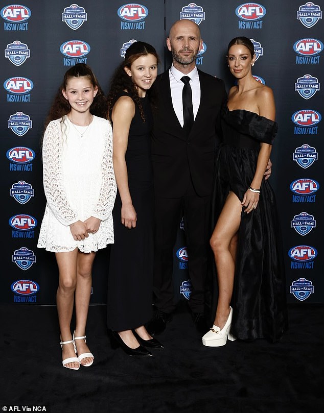 Fellow AFL great Mark McVeigh was also present with his wife and children.
