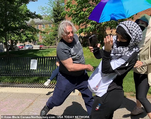 A skirmish during a pro-Palestine demonstration at Rutgers University, New Jersey.  A student camp had been set up on campus in scenes reminiscent of many across the country.