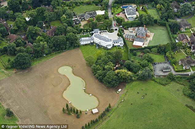 The £16 million property, now owned by the Sultan of Oman, includes a fishing lake (centre in photo)