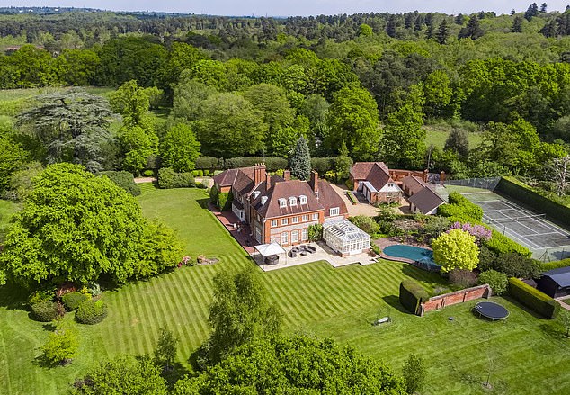 The former English footballer bought this sprawling 18th-century seven-bedroom property in Surrey in 2019 for £4.1 million.