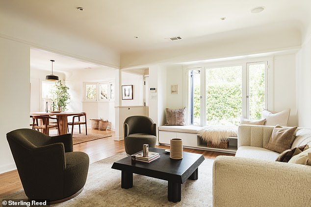 The living room also has a built-in bench overlooking the front garden and features a Tudor-inspired vaulted ceiling.