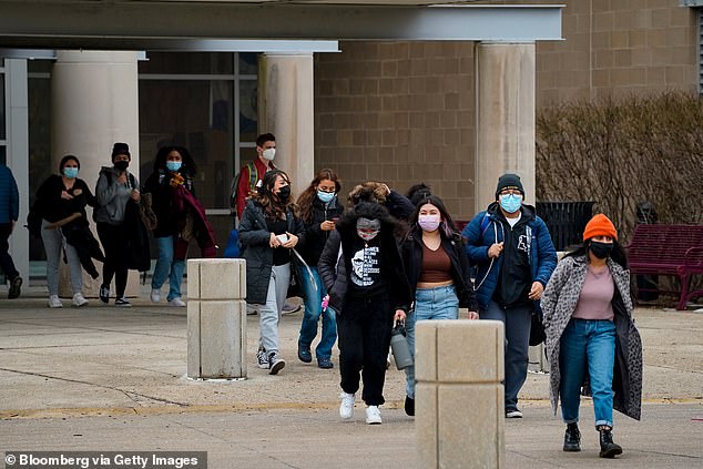 High school students leave the building during a student walkout over Covid-19 safety measures at Chicago Public Schools in Chicago, Illinois, on January 14, 2022.