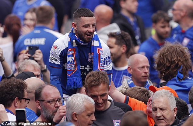 Ipswich fans went into delirium when their Premier League status was confirmed as they stormed the pitch to join the players.
