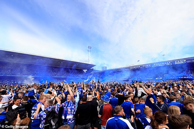 It was party time at Portman Road as fans filled the grass before letting out blue smoke.