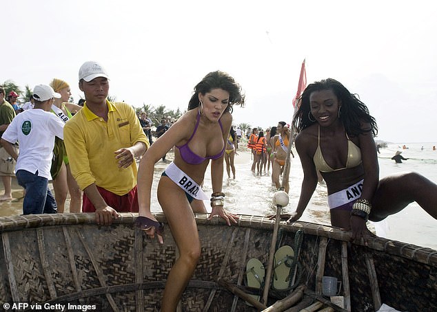 Anderle, currently living in the United States, traveled to Brazil to reunite with her family and prepare for the birth of her child in Roca Sales, her hometown (Pictured: Anderele enjoys a boat ride at a beach party in central Vietnam on June 25, 2008)
