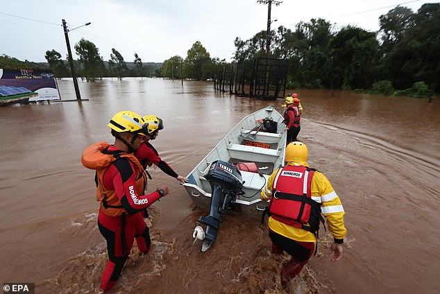 A handout photo made available by the Government of Rio Grande Do Sul shows rescue workers searching for survivors in the floods caused by heavy rains in Rio Pardinho, Brazil, May 1 2024