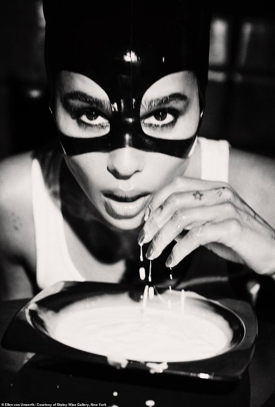 And one from 2005 shows Catwoman alum Zoë Kravitz leaning over a bowl wearing a black mask.
