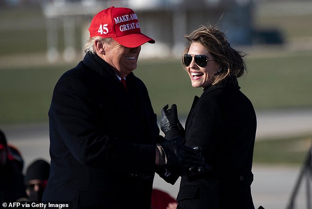 Hope Hicks smiles at U.S. President Donald Trump during a Make America Great Again rally at Dubuque Regional Airport on Nov. 1, 2020, in Dubuque, Iowa.