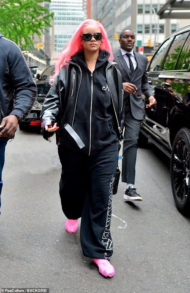 The 36-year-old singer showed off her striking bright pink locks while modeling a casual ensemble and stepping out in New York City.