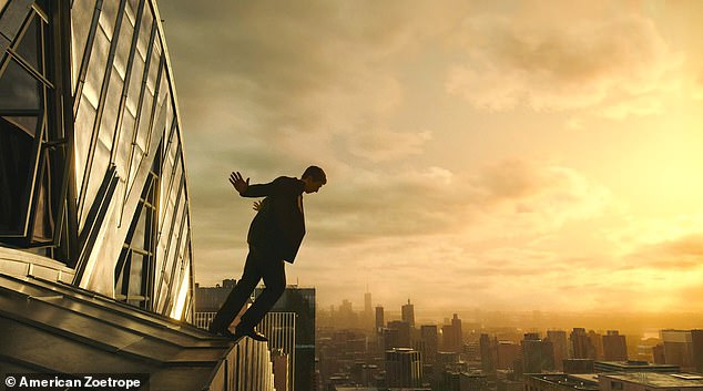 In the clip, Caesar Catilina, played by Adam Driver, cautiously steps out of one of the upper windows of a New York City skyscraper and heads toward the ledge.