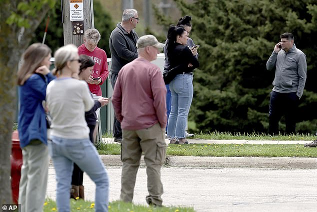Parents gathered outside the closed school as news of the shooting spread.
