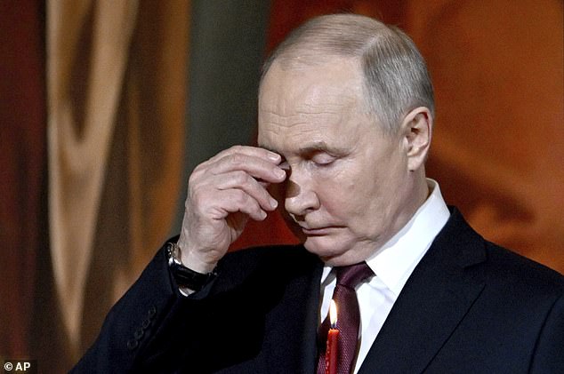 The Russian leader looked miserable as he listened to the mass that was televised throughout Russia and lasted all night.