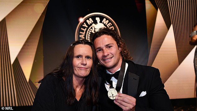 Hynes (pictured with his mother) says helping young people is better than saving lives