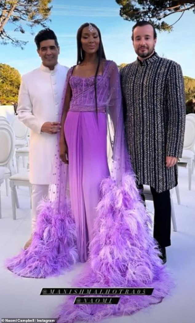 Naomi Campbell looked nothing short of sensational in a purple feather dress as she posed with friends.