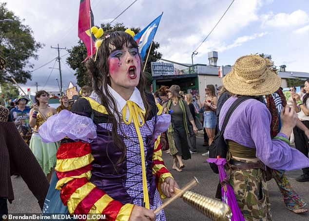 This parade-goer donned an eccentric costume and colorful face paint.