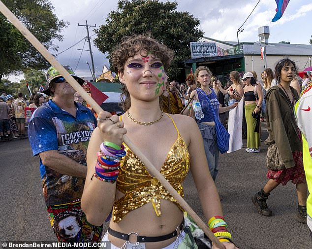 One reveler donned a gold T-shirt with a butterfly for the Cannabis Law Reform Rally and Parade.