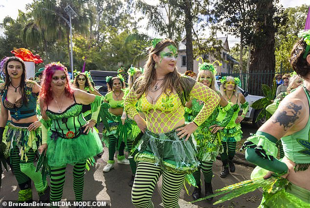 Revelers were dressed in eccentric costumes, with many wearing bright green colors with ornate marijuana leaf motifs.