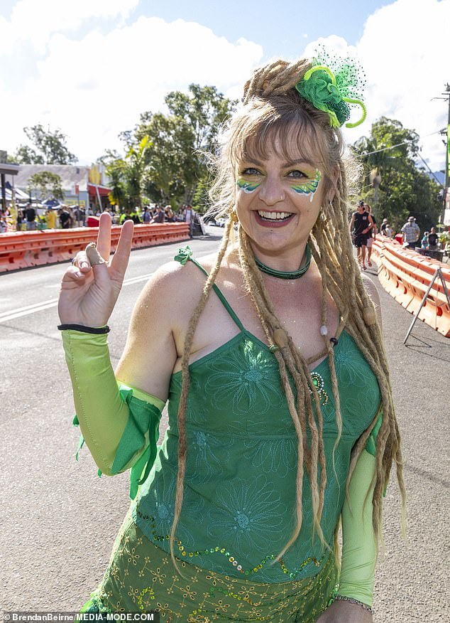 Festival goers showed off their colorful costumes as they marched through Australia's marijuana capital.