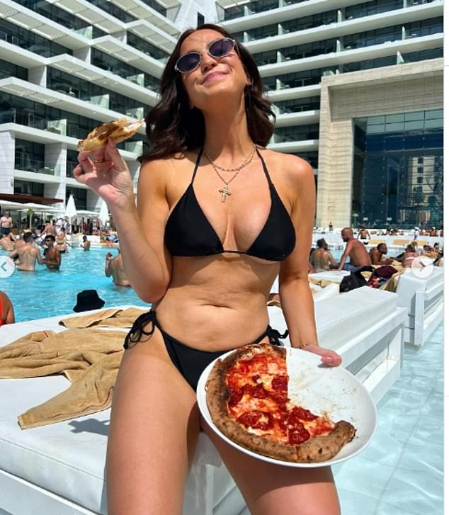 The radio and television personality showed off her toned physique in a skimpy two-piece while sitting poolside at Five Luxe eating a plate of pepperoni pizza.