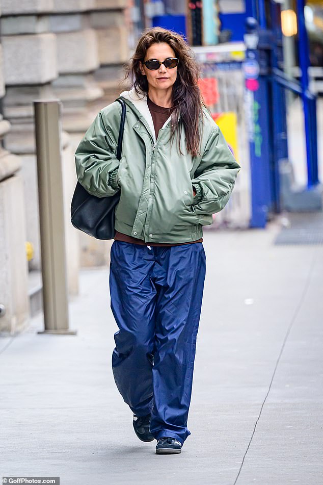 Katie Holmes taking a walk through New York City in Adidas sneakers