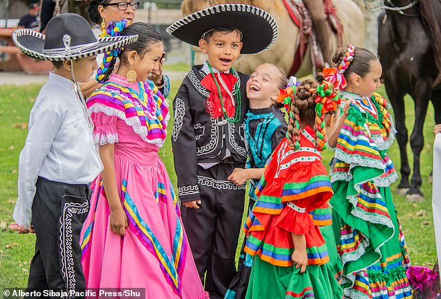 Children were also seen dressed in vibrant colors and wearing hats while girls sported colorful ribbons in their braided hair.